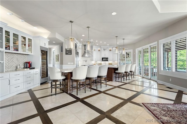 dining room with recessed lighting and baseboards