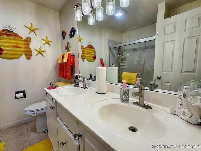 full bath with a sink, toilet, a stall shower, and tile patterned floors