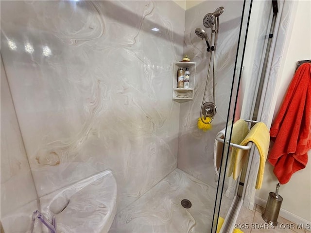 bathroom with a marble finish shower