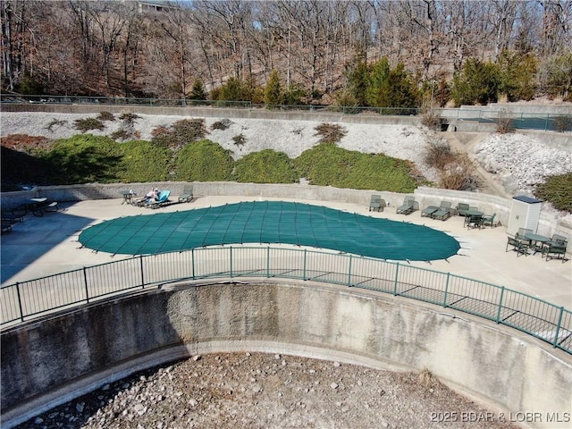 view of pool featuring a fenced in pool, a patio, and fence