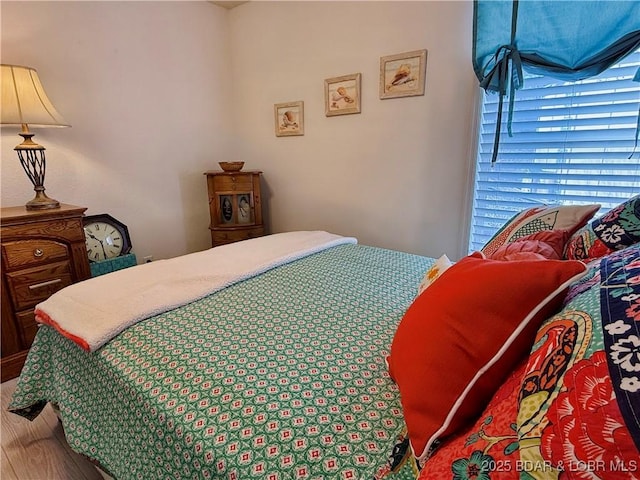 bedroom featuring wood finished floors