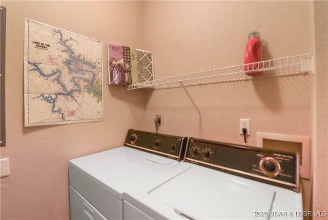 laundry area with laundry area and separate washer and dryer