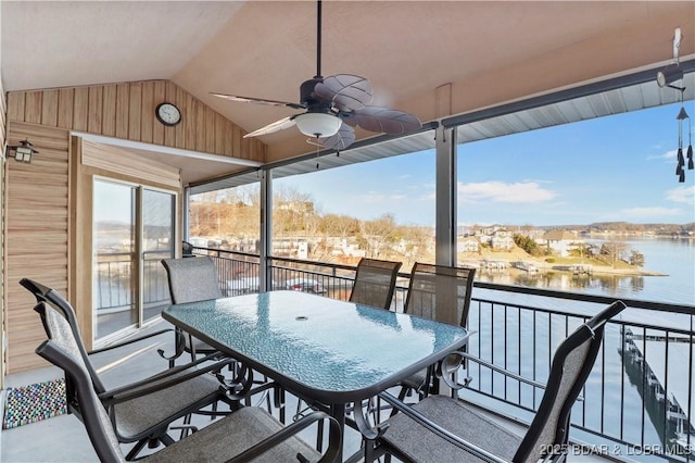 exterior space featuring outdoor dining space, a balcony, a water view, and ceiling fan