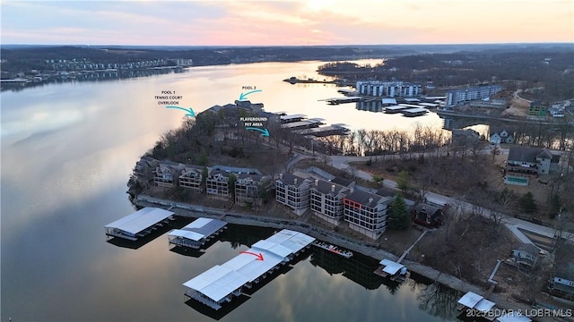 birds eye view of property with a water view