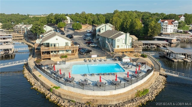 birds eye view of property with a water view