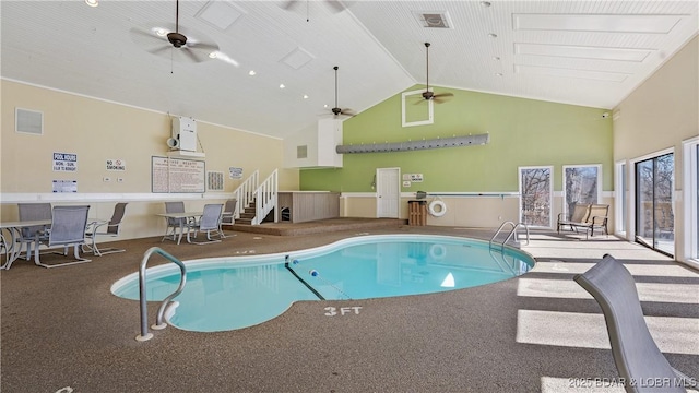 community pool featuring a hot tub and ceiling fan