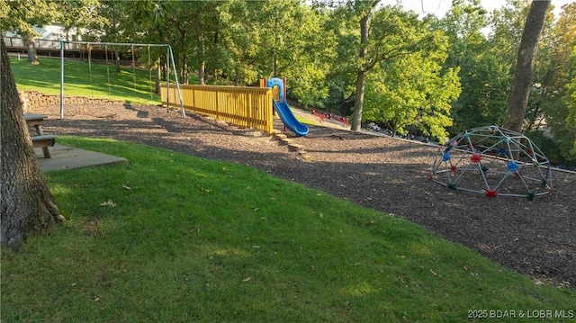 community jungle gym featuring a yard