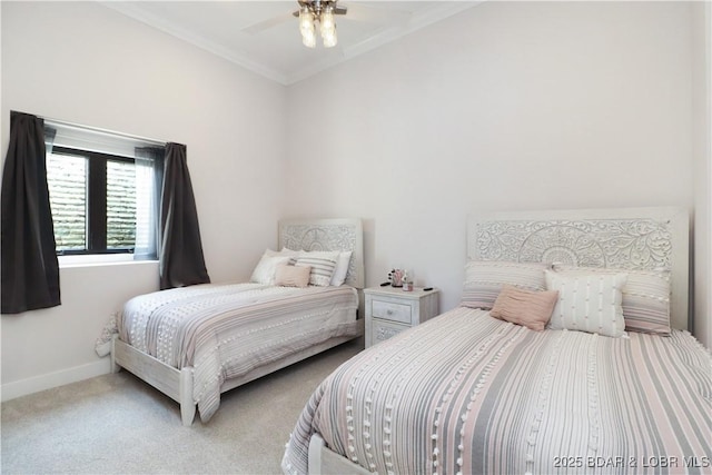 carpeted bedroom featuring ceiling fan, crown molding, and baseboards