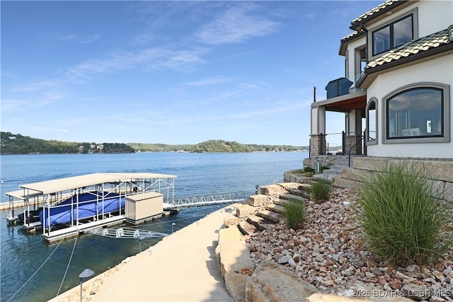 view of dock with a water view