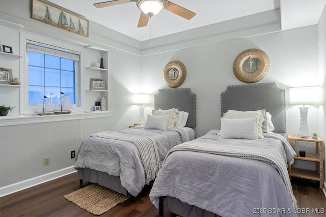 bedroom with ceiling fan, baseboards, and wood finished floors