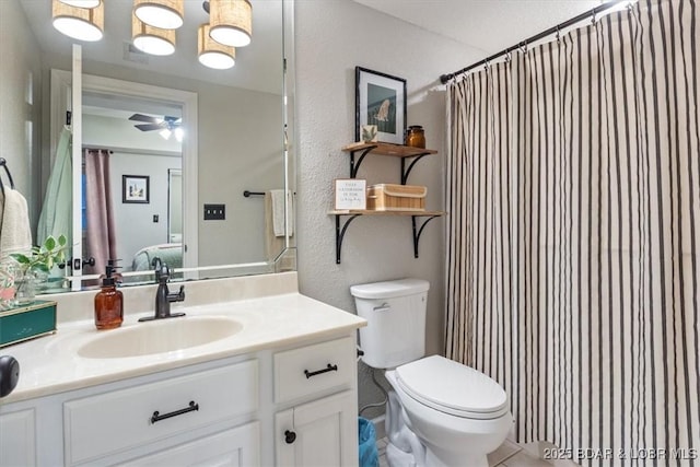 bathroom with toilet, a shower with shower curtain, connected bathroom, ceiling fan, and vanity