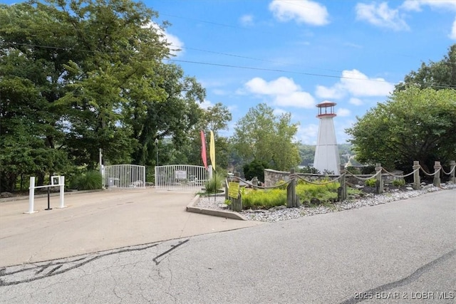 exterior space featuring fence and a gate