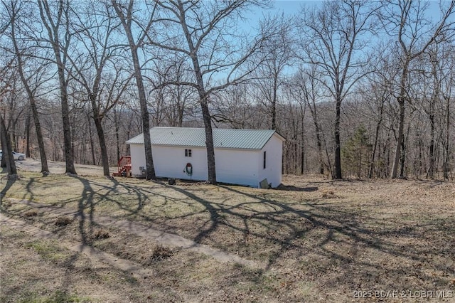 exterior space with a view of trees