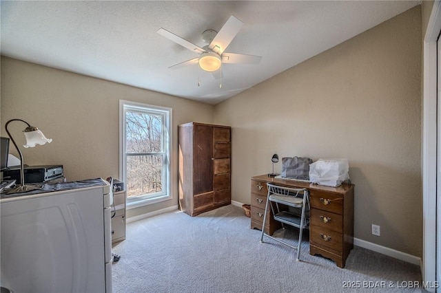 office area with baseboards, carpet, washer / dryer, and ceiling fan