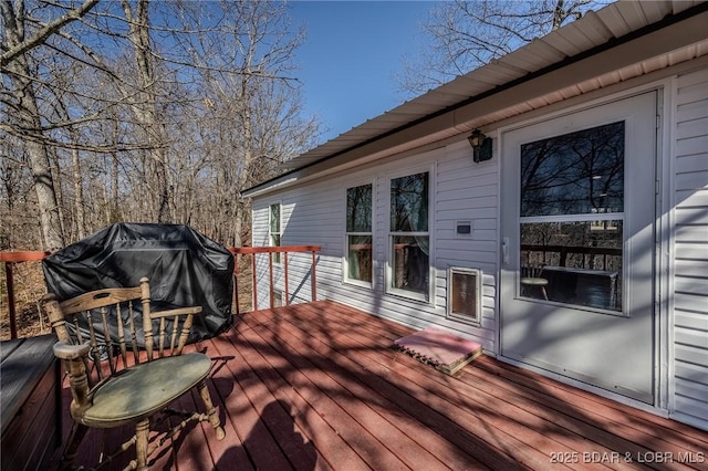 wooden terrace with grilling area