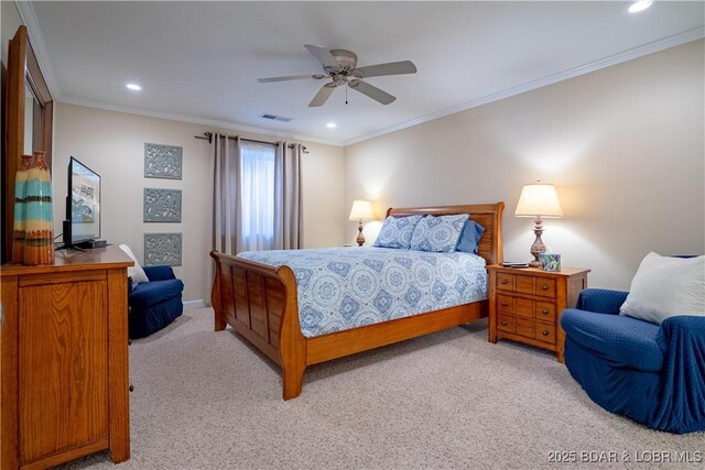 bedroom with visible vents, light carpet, a ceiling fan, recessed lighting, and crown molding