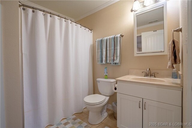 bathroom featuring vanity, tile patterned floors, toilet, and ornamental molding