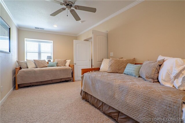 bedroom featuring visible vents, ornamental molding, a ceiling fan, carpet flooring, and baseboards