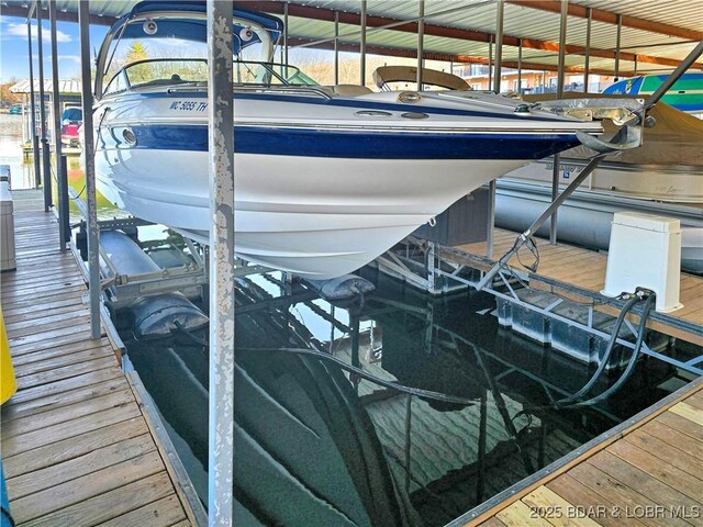 view of dock with boat lift