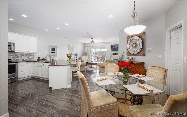 dining space with recessed lighting, dark wood-type flooring, and ceiling fan