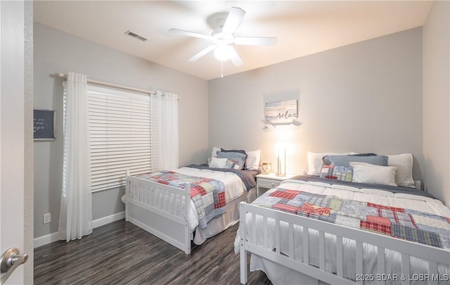 bedroom with visible vents, baseboards, a ceiling fan, and wood finished floors