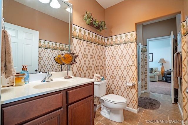 full bath featuring toilet and vanity