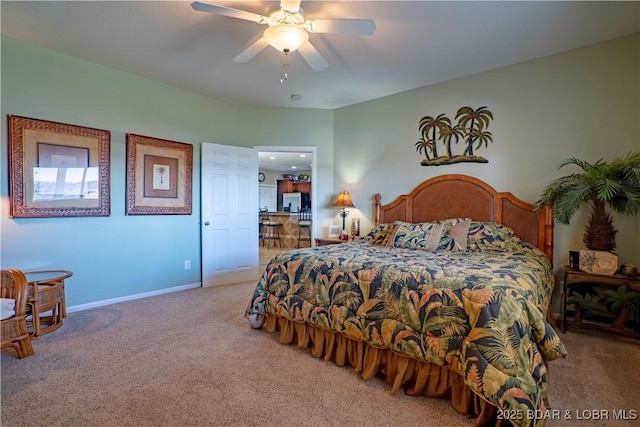 bedroom with ceiling fan, baseboards, and carpet