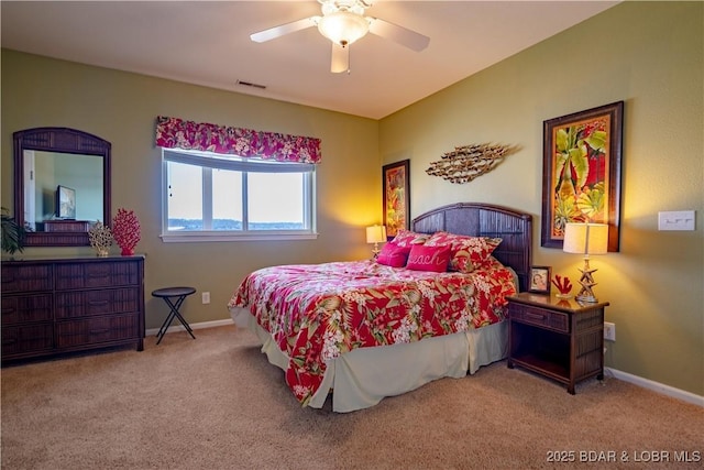 bedroom with visible vents, baseboards, carpet, and ceiling fan