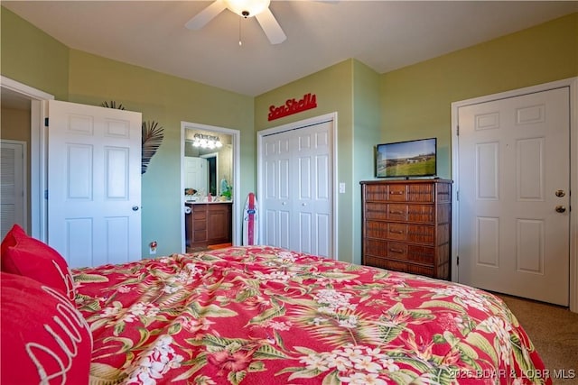 carpeted bedroom with a closet, ensuite bath, and a ceiling fan