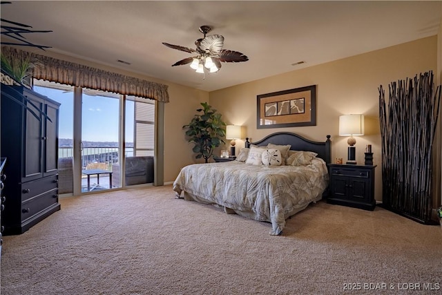 bedroom with visible vents, a ceiling fan, and access to outside