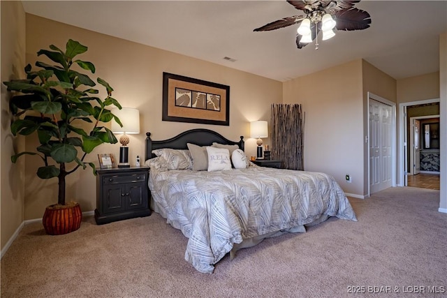 carpeted bedroom featuring a ceiling fan, baseboards, and visible vents