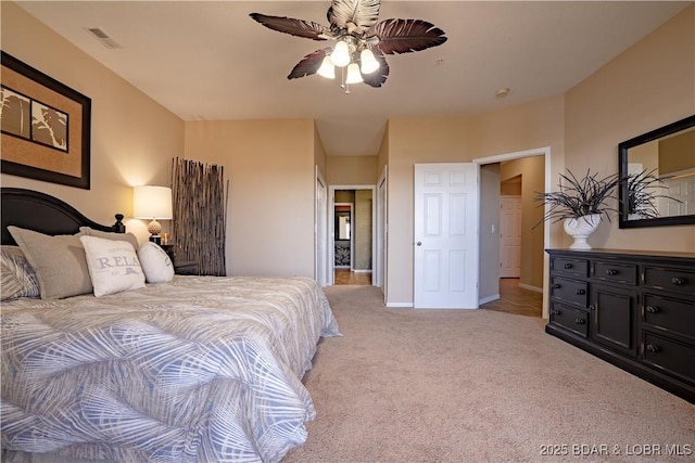 bedroom featuring visible vents, light carpet, baseboards, and ceiling fan