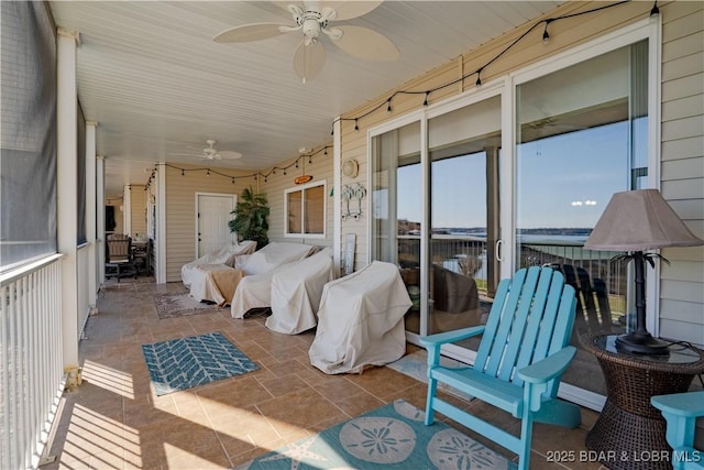 sunroom / solarium with ceiling fan