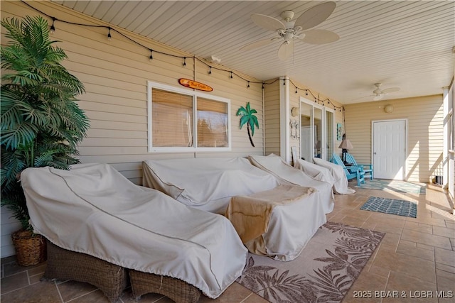 exterior space featuring track lighting and a ceiling fan