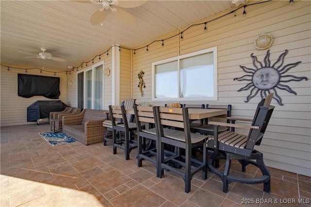 view of patio / terrace featuring outdoor dining area and a ceiling fan