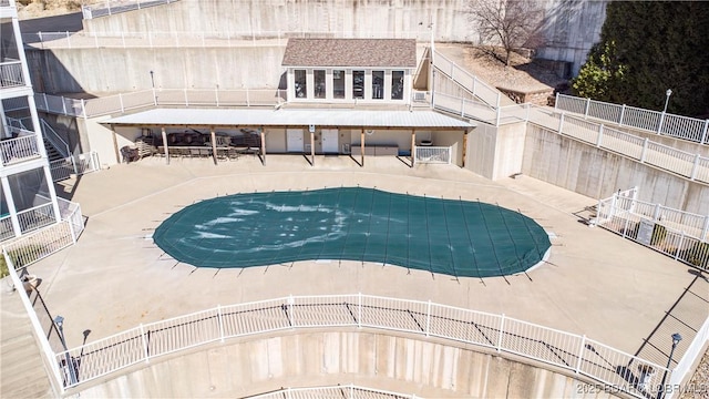 pool featuring a patio and fence