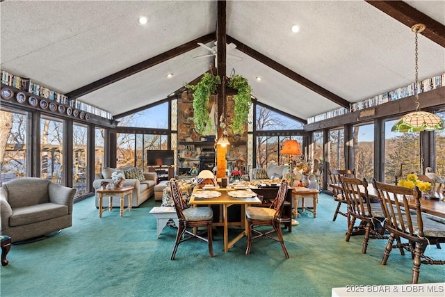 sunroom / solarium with lofted ceiling with beams