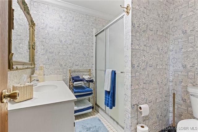 full bathroom featuring wallpapered walls, tile patterned floors, toilet, and ornamental molding