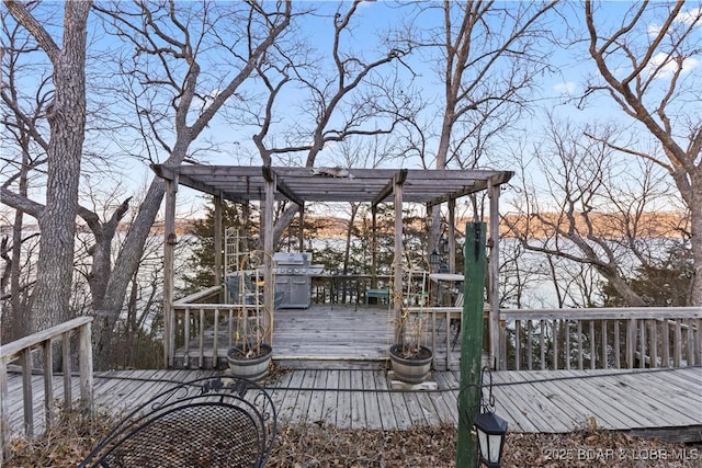 wooden deck with a pergola and grilling area