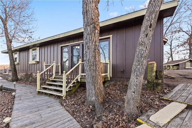 back of house featuring board and batten siding