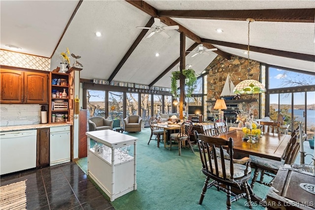 kitchen featuring light countertops, beam ceiling, brown cabinets, white dishwasher, and a ceiling fan