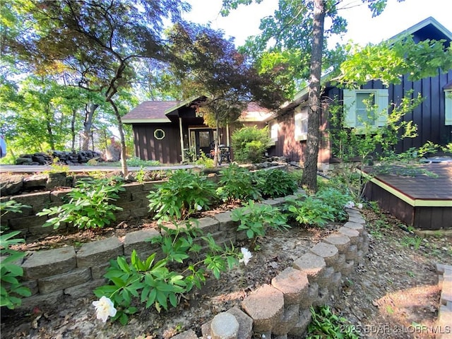 64 Fox Point Dr, Roach, MO 65787 - rear view of house featuring board and batten siding and a deck