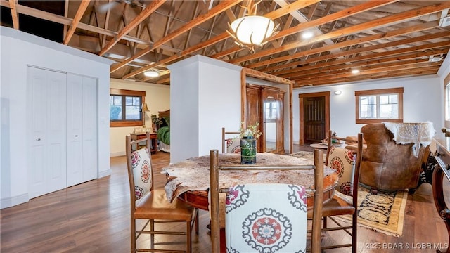 dining space with plenty of natural light and wood finished floors