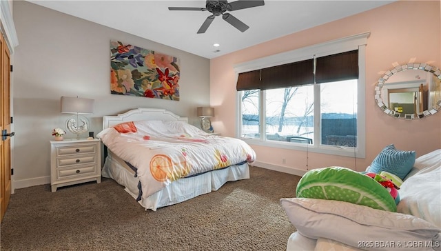 carpeted bedroom with baseboards and ceiling fan