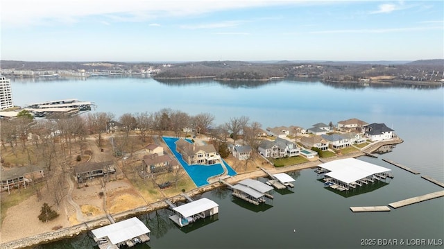 birds eye view of property featuring a water view