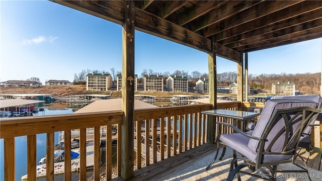 wooden deck featuring a water view