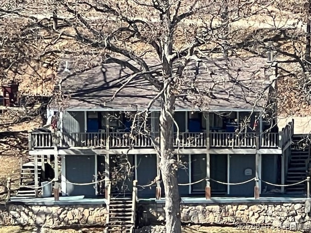 exterior space featuring a deck and stairs