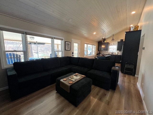 living room with wooden ceiling, wood finished floors, baseboards, and vaulted ceiling