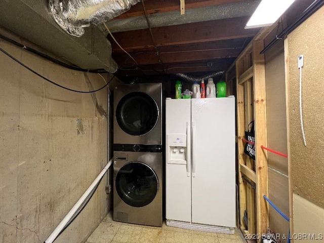 washroom with laundry area and stacked washer and clothes dryer