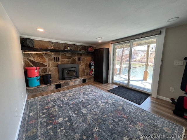 living room featuring visible vents, baseboards, and wood finished floors